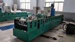 Roof panel roll forming machine